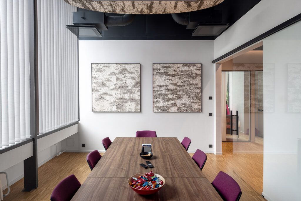 Meeting room with two birch-bark-pattern textured panels on the wall