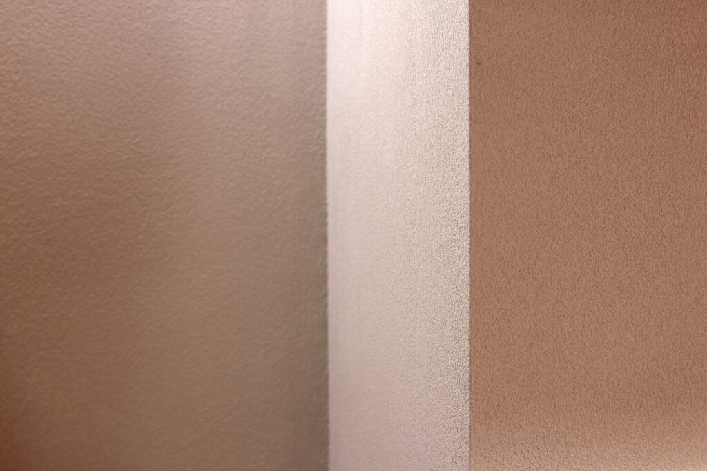 Close-up of three matt textured surfaces in different tones